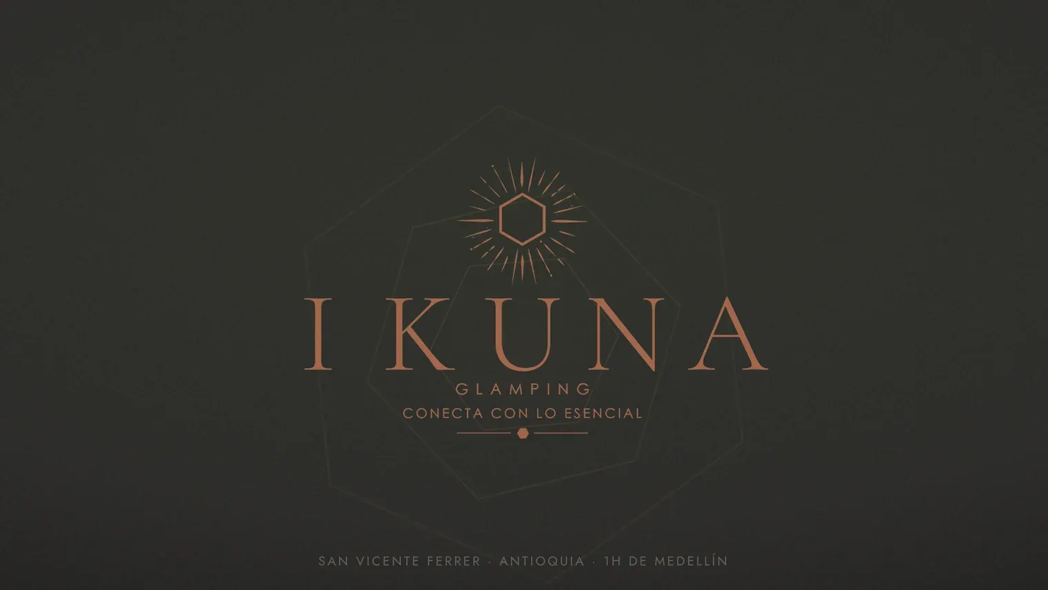 The Ikuna Glamping wordmark on the home page we built, over a dark textured background