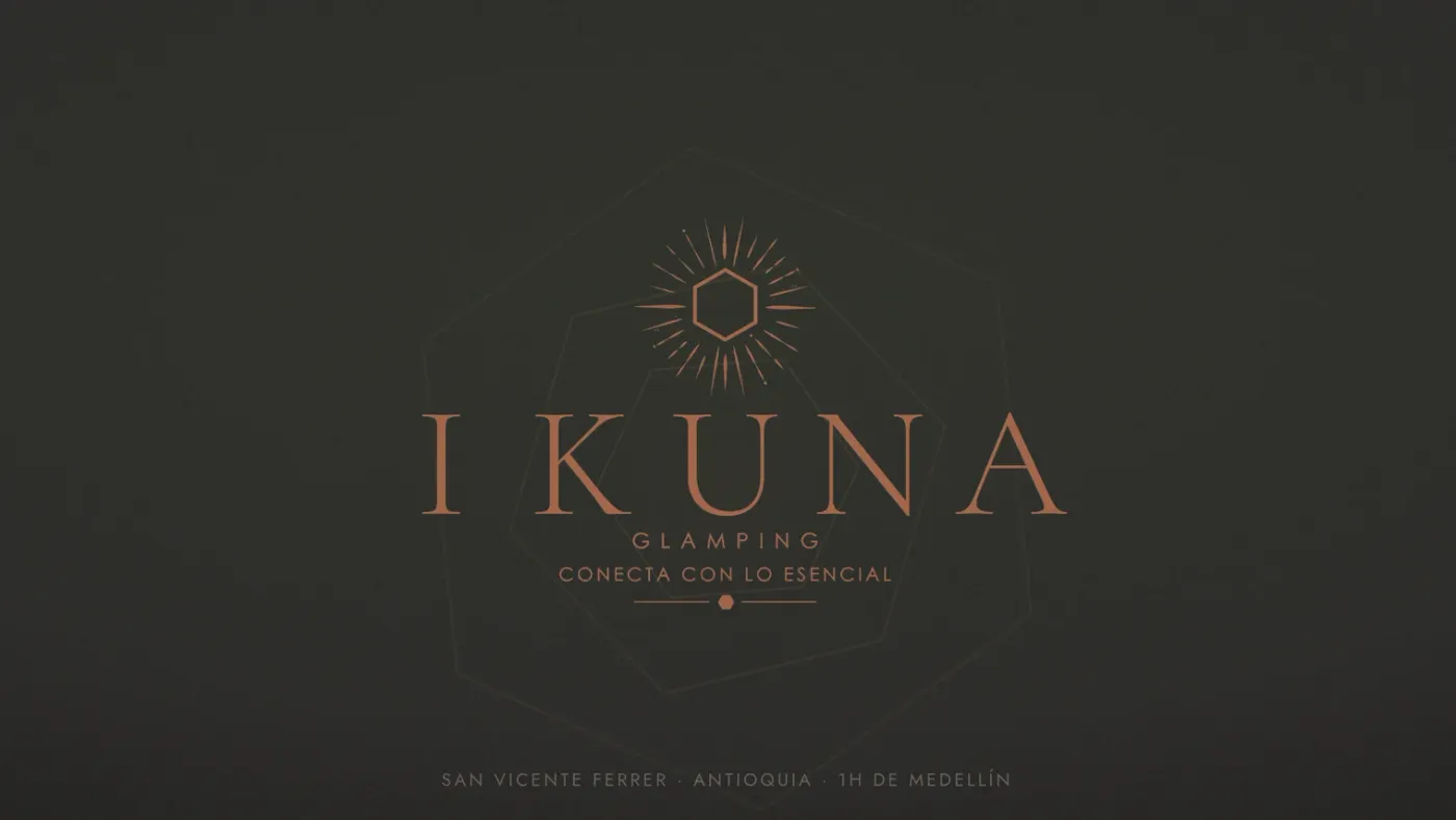 The Ikuna Glamping wordmark on the home page we built, over a dark textured background